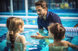 © wai - Swimming teacher teaching children to swim in the swimming pool