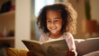 © Chanelle/Peopleimages - AI - Toddler girl reading a book. Education and learning literacy. Kid reading a story