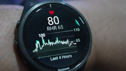 Close up of Garmin smart watch with health app icon monitoring heart rate