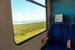 Train traveling to Sylt island, in Germany. Window view with Wadden Sea and swamp