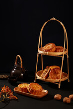 Two-tier Bamboo Basket With Some Delicious Mooncakes Decorated On Over Black Background. Chinese Lanterns And Full Moon Over Night River For Mid-autumn Festival