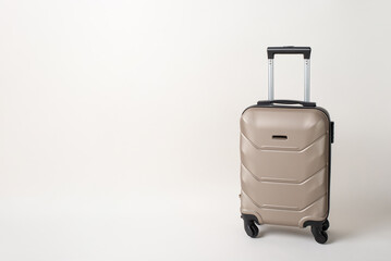 On-the-Go Essentials: Trendy suitcase showcased in a side view image, set against a white background, with space for text or advertising