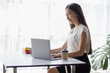 © David - Happy young Asian girl working at a office with a laptop calculator to calculate business accounting statistics concept