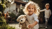 Happy Child Holding Teddy Bear And Jumping With Parents Near Home
