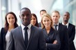 © Acronym - Multiracial diverse business team headed with boss posing to camera. Smiling businesspeople in office. The concept of business.