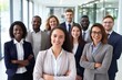 © Acronym - Multiracial diverse business team headed with boss posing to camera. Smiling businesspeople in office. The concept of business.