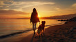 Stylish woman with her dog walking on the beach at sunset. A European woman spends time with her pet against the backdrop of the sea and the setting sun.