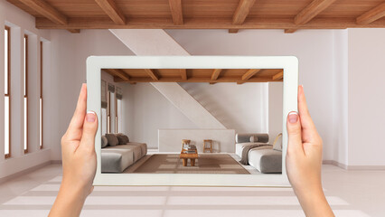 Wall Mural - augmented reality concept. hand holding tablet with ar application used to simulate furniture and de