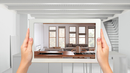 Wall Mural - augmented reality concept. hand holding tablet with ar application used to simulate furniture and de