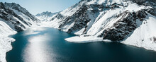 Aerial Panoramic View Of The Snowing Mountains Surrounding Laguna Del Inca In The Chilean Andes, Chile.