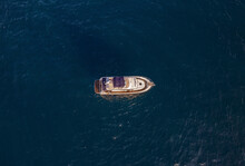 Aerial View Of A Luxury Boat Floating In A Tranquil Sea With Clear Blue Water, Zona Encinas, Cumbre Del Sol, Alicante, Spain.