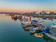 Faro, Portugal - 27 July 2023: Aerial View Of Boats Moored Along The Pier At Sunset In Santa Luzia, Faro, Algarve, Portugal.