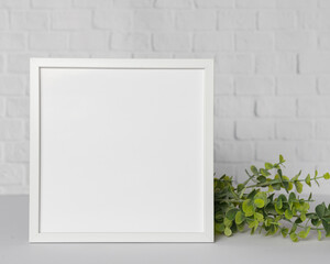 Minimal wooden picture poster frame mockup on white wallpaper