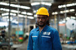 © KANGWANS - African American worker in factory Maintenance and repair work in modern industrial concepts. workers working in factories Professional engineer.