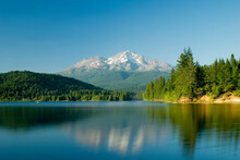 Mount Shasta Reflected In A Tranquil Lake; California United States Of America