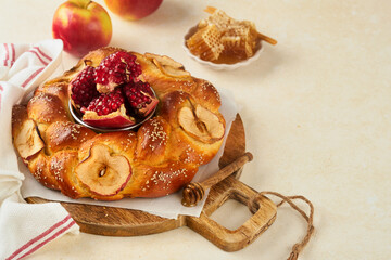 Wall Mural - Jewish Holidays - Rosh Hashanah or Rosh Hashana. Pomegranate, apples, honey and round challah on rustic grey table background. Jewish Autumn celebration. Shana Tova. Yom kippur concept. Top view.