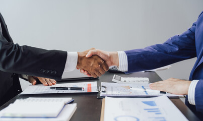 Business handshake for teamwork of business merger and acquisition,successful negotiate,hand shake,two businessman shake hand with partner to celebration partnership and business deal concept