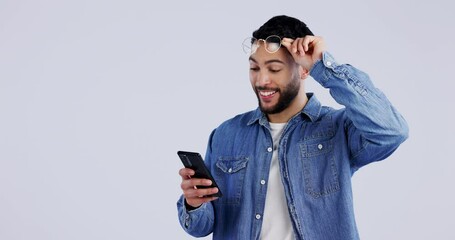 Poster - Meme, surprise or man excited by phone notification in studio for online bonus or fashion sale. Glasses, shock or happy person on blue background for mobile app promotion, message or good news