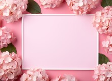 Beautiful Pink Hydrangea Flowers, White Wooden Photo Frames On Pink Background Top View Flat Lay Copy Space. Flower Card