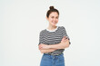 © Mix and Match Studio - Image of charismatic young woman in striped t-shirt and jeans, looking confident and happy, smiling at camera, candid emotions, white background