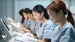© visoot - Medical intern studies assistant in an exam room.