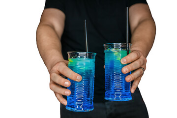 Bartender's hands serve 2 alcoholic cocktails with blue syrup blue lagoon in the white isolated background