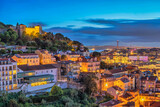 Fototapeta Tulipany - Lisbon Portugal sunset city skyline at Lisbon Baixa district and Saint George Castle