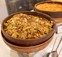 Sticker - A dish of stewed vegetables on a plate in a restaurant