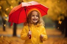 Happy Funny Child With Red Umbrella Under Autumn Shower.Girl Wearing Yellow Raincoat And Enjoying Rain.Child Playing Outside On Nature. Family Walk In The Park. 