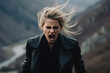 Anger European Woman In A Black Coat On Mountain Scenery Background