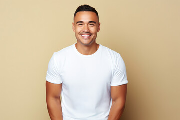 Wall Mural - design mockup: hispanic man wearing a blank white t-shirt, studio shot