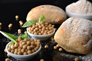 Wall Mural - Decorating buns with freshly prepared soy flour on black kitchen