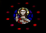 Fototapeta Nowy Jork - Detail of the Christ Pantocrator within the rose wheel window of the West façade of the Lisbon Saint Mary Cathedral. Taken in Portugal in Septembre 2023.