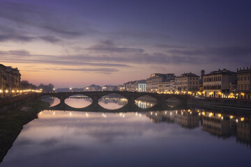 Wall Mural - Carraia medieval Bridge on Arno river at sunset. Florence, Italy