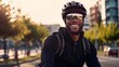 Representation of a upbeat grinning man dressed in cycling dress head protector and shades riding a bike on the black-top outoftown bike way Dynamic lively individuals concept picture