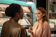 Beauty customer talking to cosmetician to consulting for test the cosmetic makeup in the department store booth.
