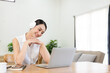 © ArLawKa - Beautiful Asian woman and headphones use laptop at home to write notes Attractive female student learning language Watch the webinar online online internet education