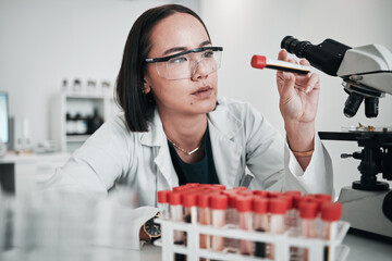 scientist, woman and blood test, microscope or laboratory research for dna, virus analysis or medica