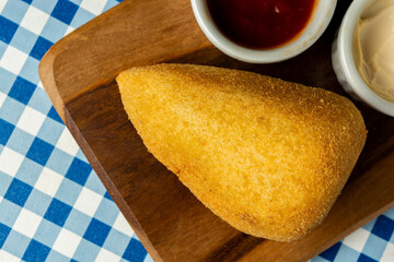 traditional Brazilian coxinha. typical fried snack food stuffed with meat and chicken