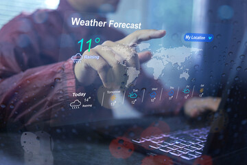 man wearing rain coat using application weather forecast before going out home checking weather with