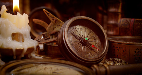 Wall Mural - Vintage style travel and adventure. Vintage old compass and other vintage items on the table.