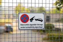 Sign On A Property Entrance Saying That Parking Is Prohibited And Cars Will Be Towed Away. German Traffic Sign Forbidding Staying On The Driveway.