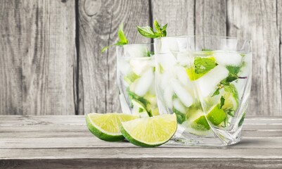 Poster - Tasty cold cocktail with ice and fresh lime slice