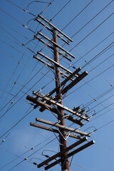 Wall Mural - Electricity pylon under blue sky