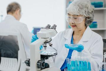 Wall Mural - Modern medical laboratory: two scientists work with micropipettes Analyze biochemical samples Advanced Medical Science Laboratory