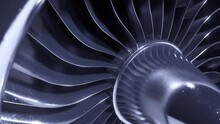 A Large Jet Engine Turbine Full Screen, With A Lot Of Silver Blades Interconnected To Each Other And A Central Silver Dome. Energy Concept