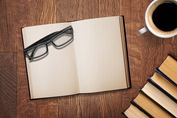 Wall Mural - open retro book with reading glasses