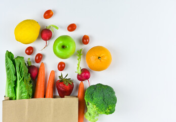 Healthy food background, healthy vegetarian food in paper bags, fruits and vegetables, banner copy space, supermarket shopping, food and clean vegetarian diet concept, organic fruits and vegetables co