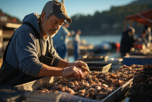 A Caucasian Man Sells Fresh Seafood At The Fish Market