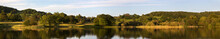 Panoramic Landscape Reflected In A Tranquil Lake; Lake District, Cumbria, England